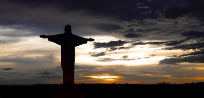 At sunset the outline of the statue
